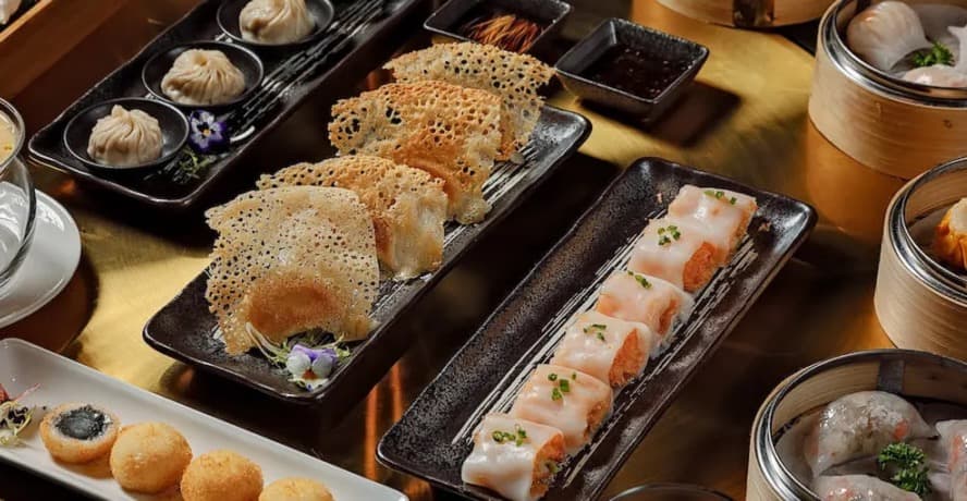 A shared table of dim sum and seafood from the best Chinese restaurants Toronto 2026, spanning Chinatown to Scarborough